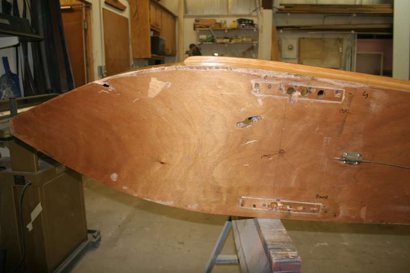 IMG_8705.JPG - Not too much damage. The hull-plate areas are pretty torn up, there's some scraping along the starbord edge along with a good gouge aft, a punched-in piece of the bottom-skin, and a hole through the bottom-skin and into the cockpit.